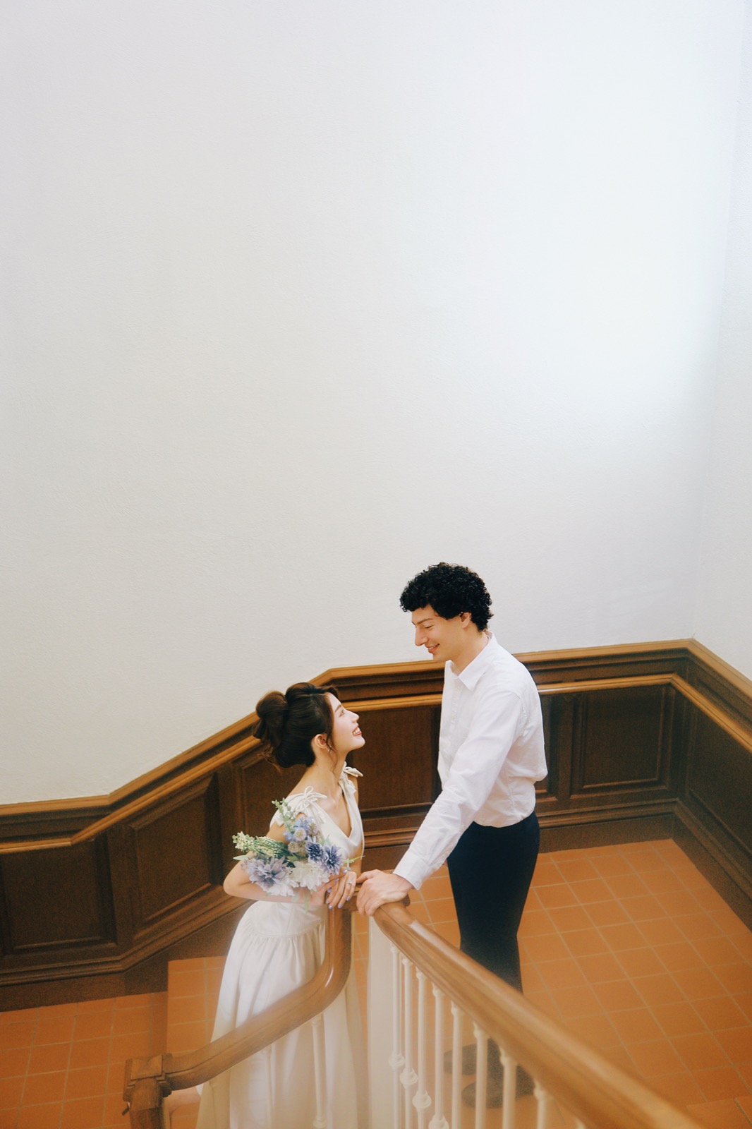 Couple on a staircase landing