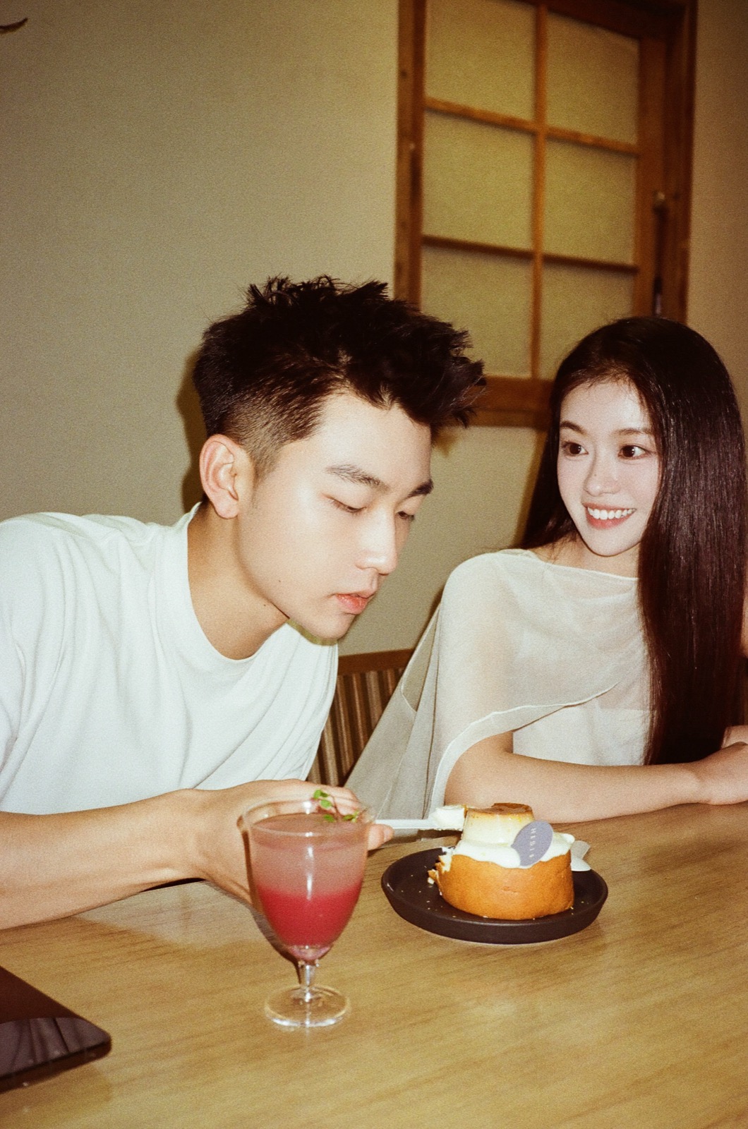 Couple sharing dessert at a cafe