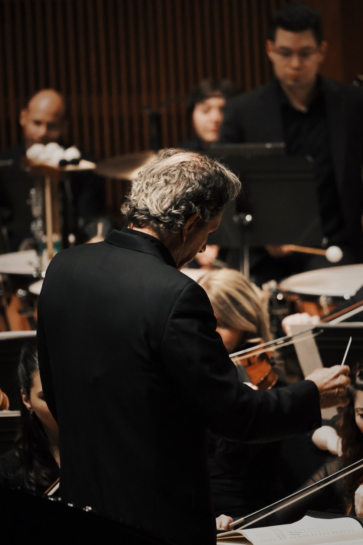 Conductor leading an orchestra