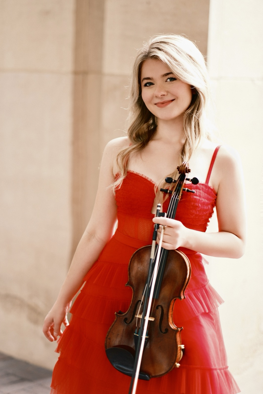 Violinist in red gown, outdoor portrait